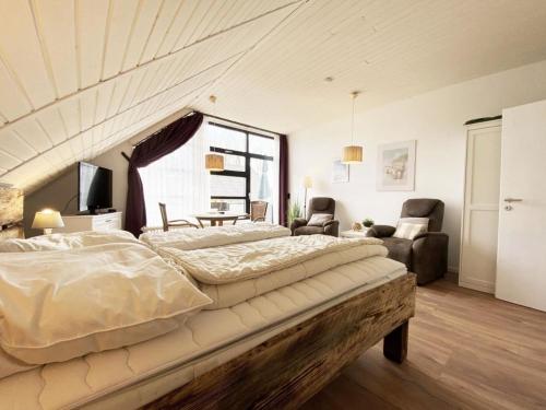 Ένα ή περισσότερα κρεβάτια σε δωμάτιο στο Ferien im Wangerland - Haus Wiesenweg - Apartment 3 1OG