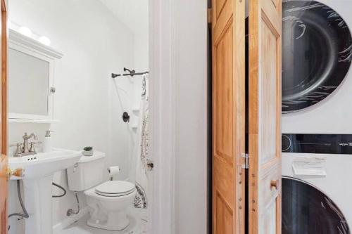 a white bathroom with a toilet and a sink at Casa Coquette+Near VA Hosp, MVP Arena & Law School in Albany