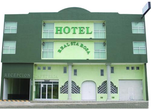a hotel with a sign on the side of it at Hotel Real Santa Rosa in Morelia
