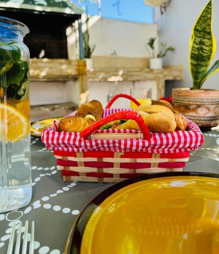 a basket of bread sitting on top of a table at Guesthouse Rondo in Himare