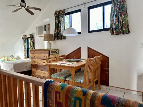 a dining room with a table and a bedroom at El Nido - Paradise in Cabo Pulmo! villa in Cabo Pulmo