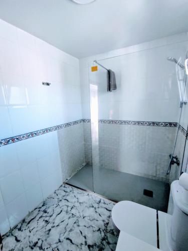 a bathroom with a shower and a toilet at Marina Sunrise Puerto in Torrevieja