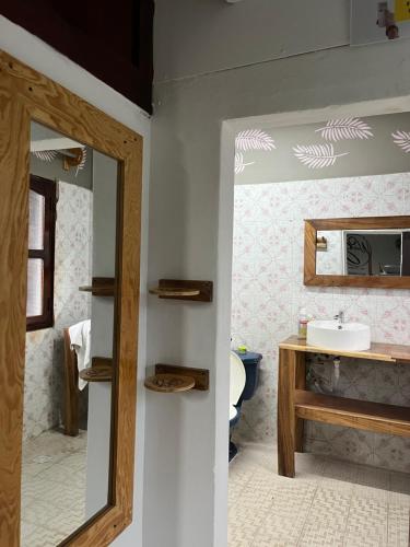 a bathroom with a mirror and a sink at The Wabi Sabi in León