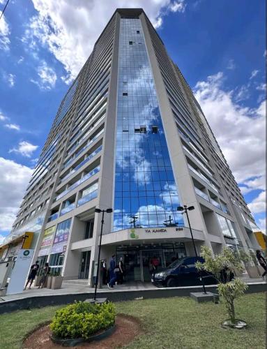 a tall building with a lot of windows at Harmonia Alameda in Guarulhos