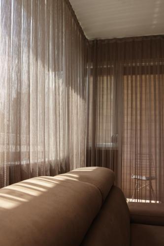 Ένα ή περισσότερα κρεβάτια σε δωμάτιο στο SkopjeLUX Apartments