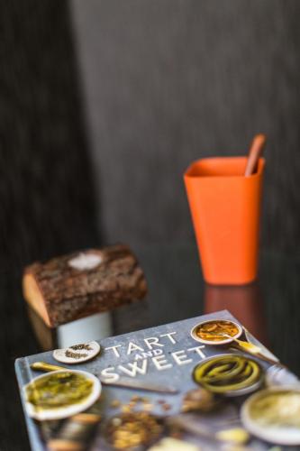 a book on a table with a cup and some food at Stanford Hillview Hotel Hong Kong in Hong Kong