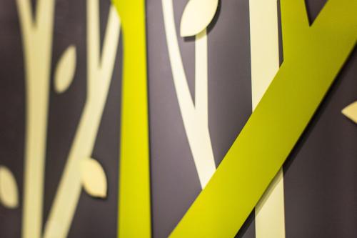 a close up of a sign with a yellow arrow at Stanford Hillview Hotel Hong Kong in Hong Kong