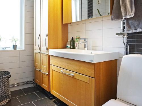 a bathroom with a sink and a toilet at Holiday home LYSEKIL XXXII in Lysekil