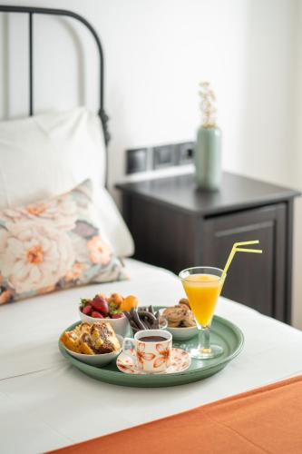 a tray of food and a drink on a table at Villa Kalliopi ΙnCreteble Cretan Resindences Collection in Xerokampos