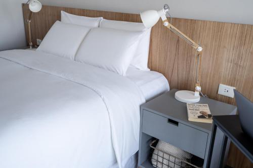 Cama o camas de una habitación en ZT Coliving and Hotel