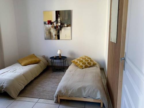 Postel nebo postele na pokoji v ubytování Charmant appartement