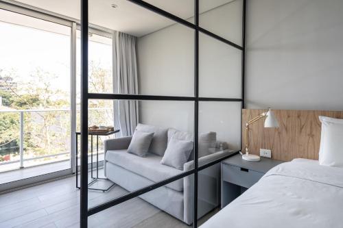 Cama o camas de una habitación en ZT Coliving and Hotel