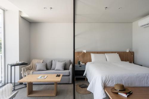 Cama o camas de una habitación en ZT Coliving and Hotel