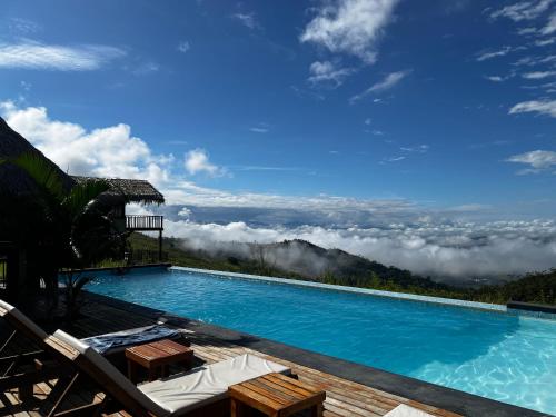 a swimming pool with a view of the mountains at El Resort de Yanashpa - Tarapoto in Tarapoto