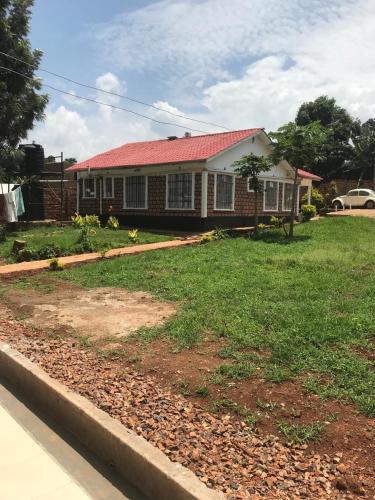 a brick house with a red roof at Smart guest house relax in Paulo