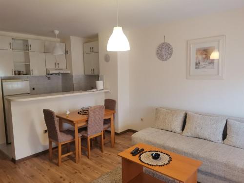 a living room with a couch and a table at DiV 3 in Novi Sad