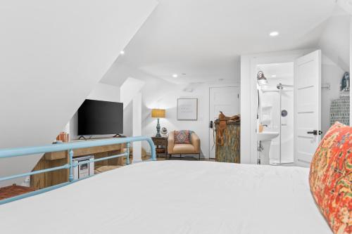 a view of a bedroom with a bed and a desk at The Benton at The Rise Retreat (L2) in Hood