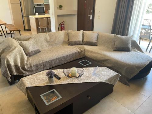 a living room with a couch and a coffee table at Villa Melydron in Nafplio