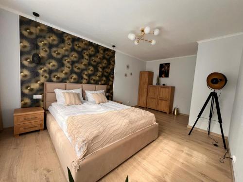 Ένα ή περισσότερα κρεβάτια σε δωμάτιο στο Apartament Julia