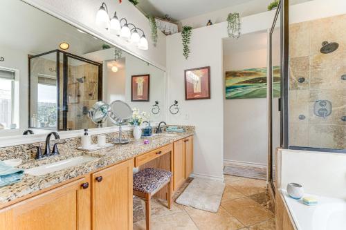 a bathroom with two sinks and a shower at Pool, Hot Tub and BBQ Family Home in Round Rock in Round Rock