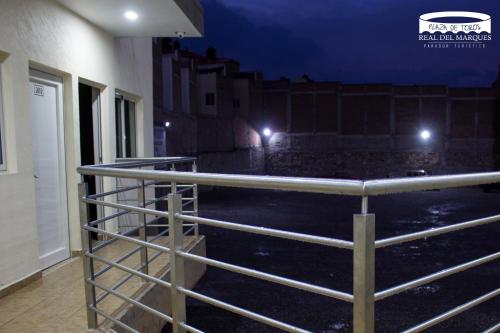 a fence in front of a room with lights at Real Plaza de Toros in San Juan de los Lagos
