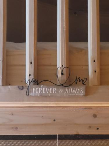 a window frame with the words forever and always at Cucu Zen Cazare Cabane Pensiuni Bucovina in Iacobeni