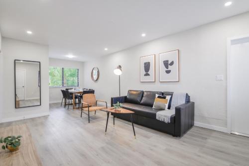 a living room with a couch and a table at Prime Location Apartment at Calle Ocho in Miami