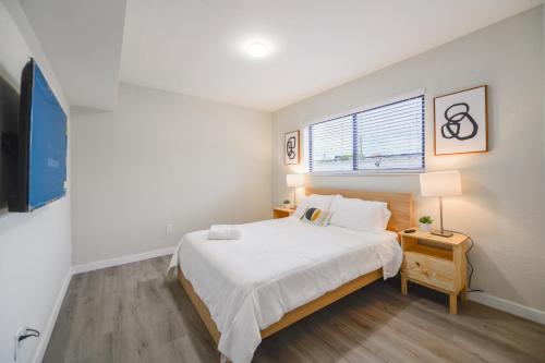 a bedroom with a large bed and a window at Prime Location Apartment at Calle Ocho in Miami