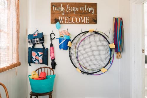 a tennis racket hanging on a wall in a room at County Escape on Corey in Bloomfield