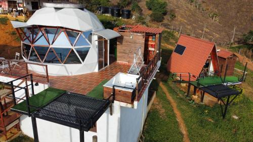 an observatory on top of a building with two chairs at Barichara Glamping Valley in Barichara