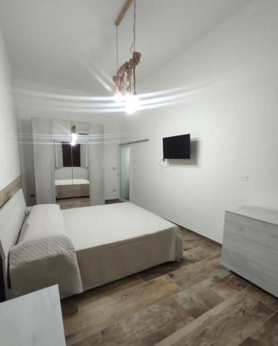 Ένα ή περισσότερα κρεβάτια σε δωμάτιο στο U Feriu home