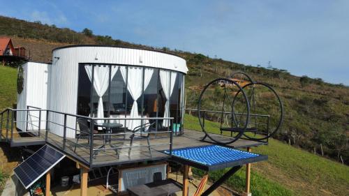 an outside view of a house with a playground at Barichara Glamping Valley in Barichara