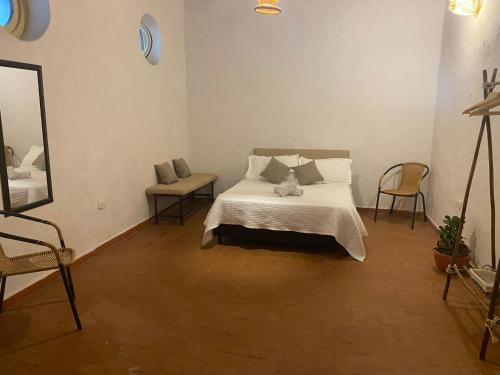 Cama o camas de una habitación en Maria Mulata Boutique Hotel