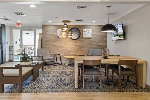 a dining room with a table and chairs at Candlewood Suites Port Arthur/Nederland by IHG in Nederland