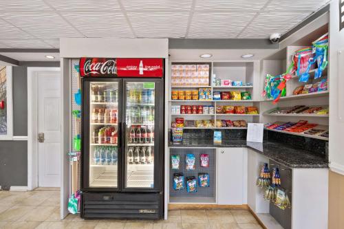 a coca cola refrigerator in a grocery store at Best Western Plus Holiday Sands Inn & Suites in Norfolk