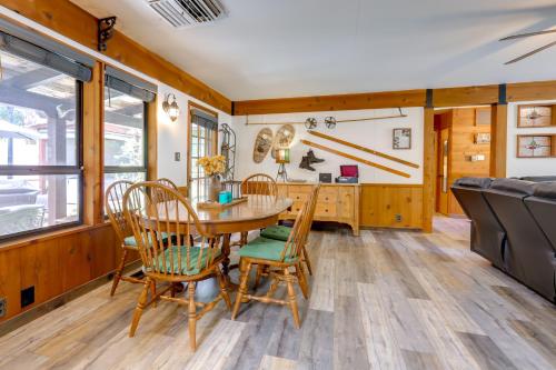 a dining room with a table and chairs at 1 Mi to Lake Hot Tub Haven in Pollock Pines! in Pollock Pines