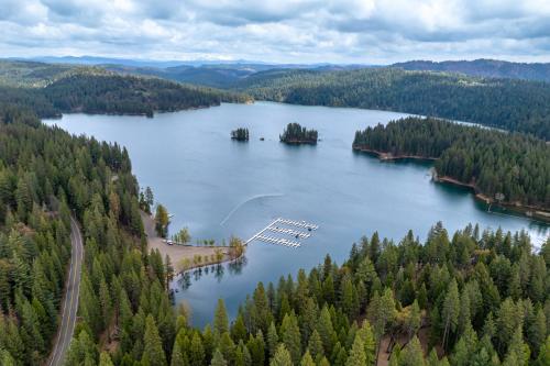 an aerial view of a lake with a dock at 1 Mi to Lake Hot Tub Haven in Pollock Pines! in Pollock Pines
