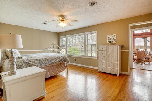 a bedroom with a bed and a ceiling fan at Lakefront Leesburg Home with Private Dock and Ramp! in Centre