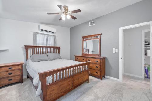 a bedroom with a bed and a ceiling fan at The Home Away From Home in Fort Myers