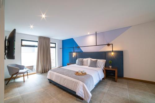 Postel nebo postele na pokoji v ubytování ERE Centenario Luxury Suites