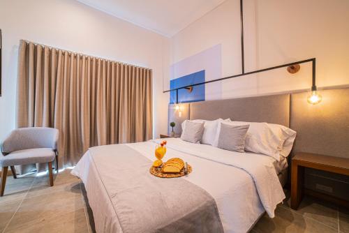 Postel nebo postele na pokoji v ubytování ERE Centenario Luxury Suites
