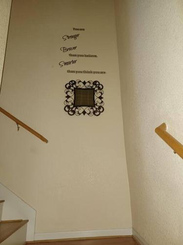 a wall with a sign on the side of a wall at Taylors Furnished Home Comforts 3bd 1 & a half bath in Temple