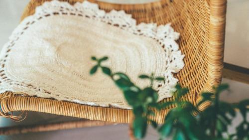 a mirror sitting on a table with a plant at Majoong Pool Villa Pension in Gyeongju