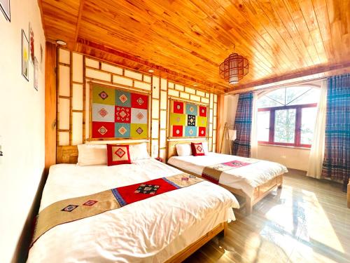 Postel nebo postele na pokoji v ubytování Huân Đậu Đậu Homestay