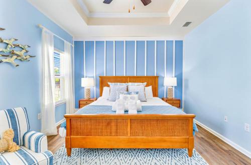a bedroom with a bed with two teddy bears on it at Half Shell Hideaway in Port Saint Joe