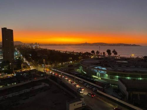 a city with a lot of traffic at night at Mar, bohemia y descanso in Coquimbo