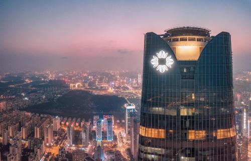 a building with a clock on the side of it at Na Lotus Hotel, a Luxury Collection Hotel, Nanning in Nanning
