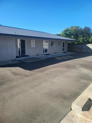 an empty parking lot in front of a building at Ferrylink Motel in Picton