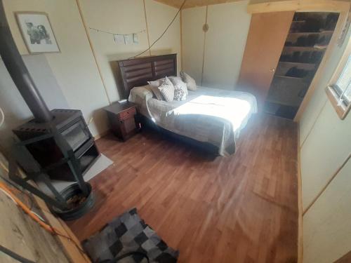 Uma cama ou camas num quarto em KENIKEN