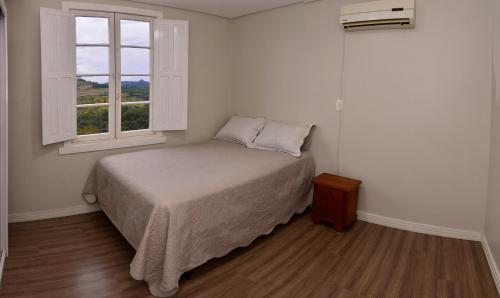 Ένα ή περισσότερα κρεβάτια σε δωμάτιο στο Casa do Vale